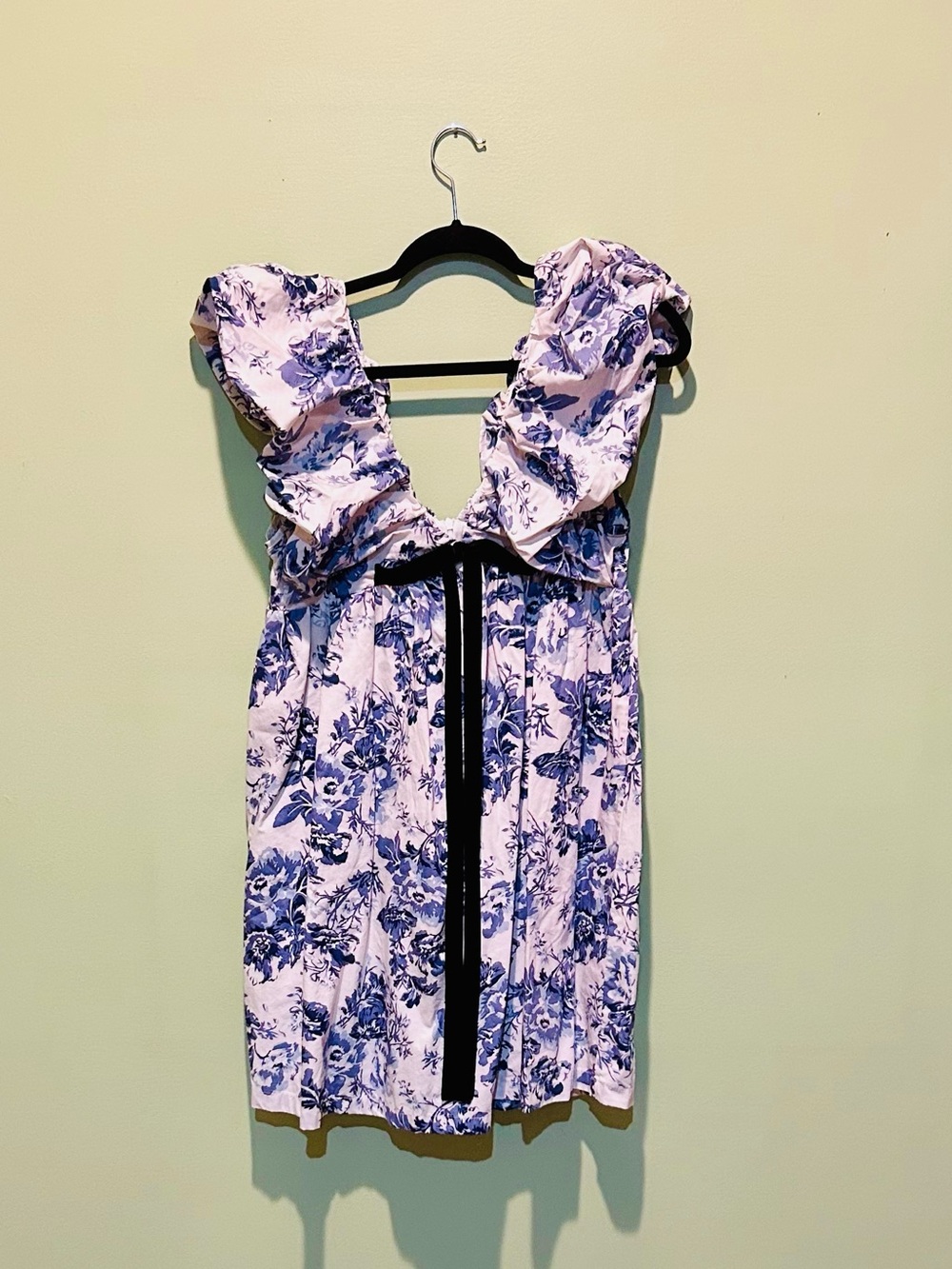 Blue Floral Mini Dress with Ruffle Shoulders and Black Tie